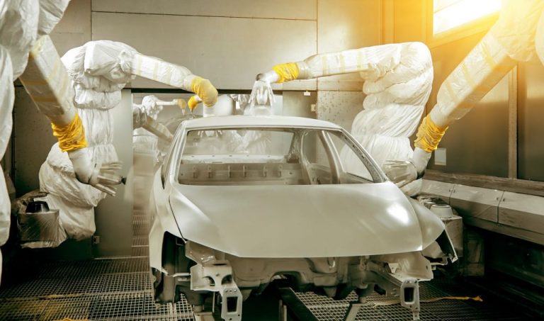 Machines painting a car